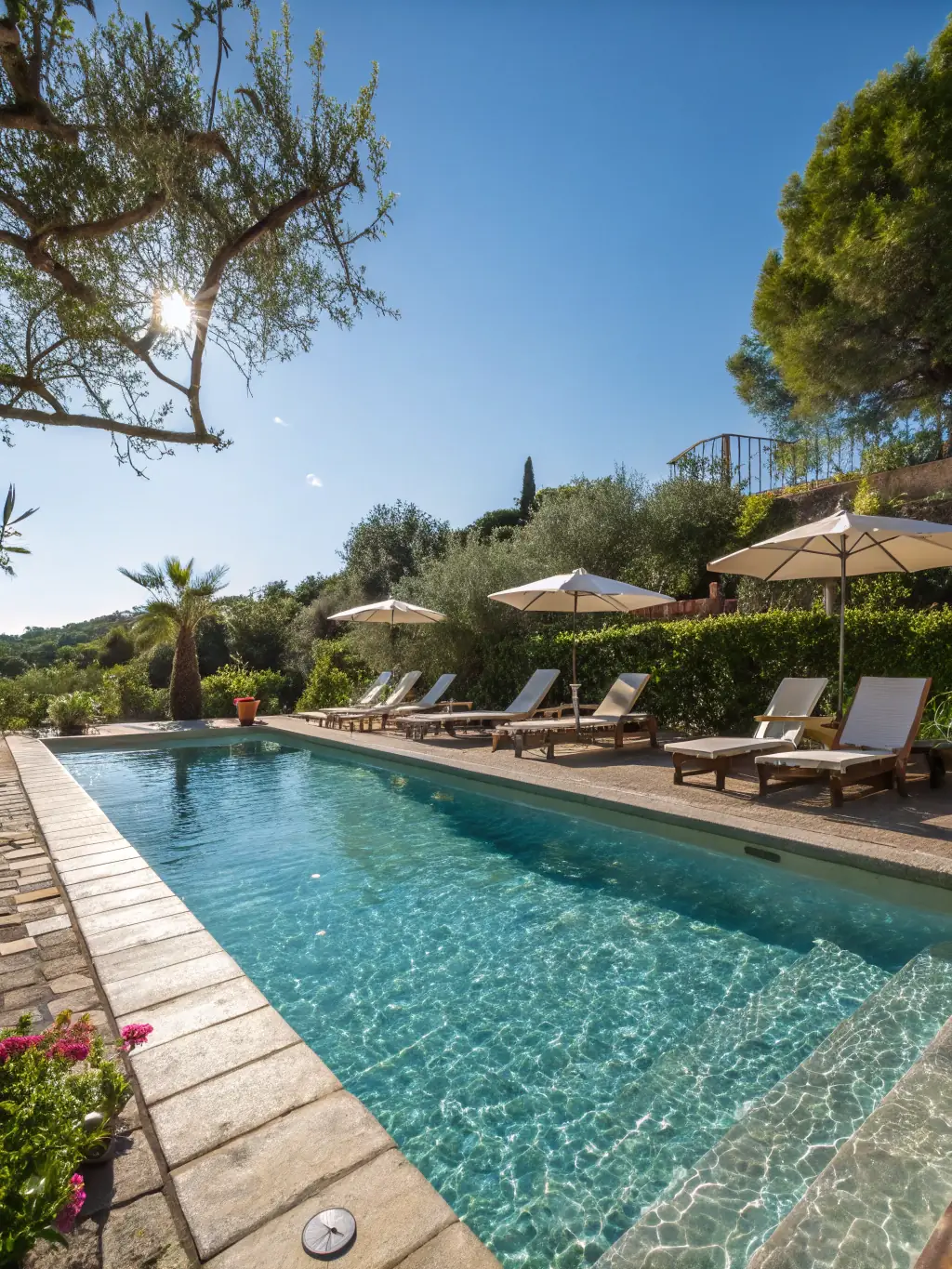 A luxury apartment complex with a swimming pool and well-maintained landscaping, representing a residential property investment.